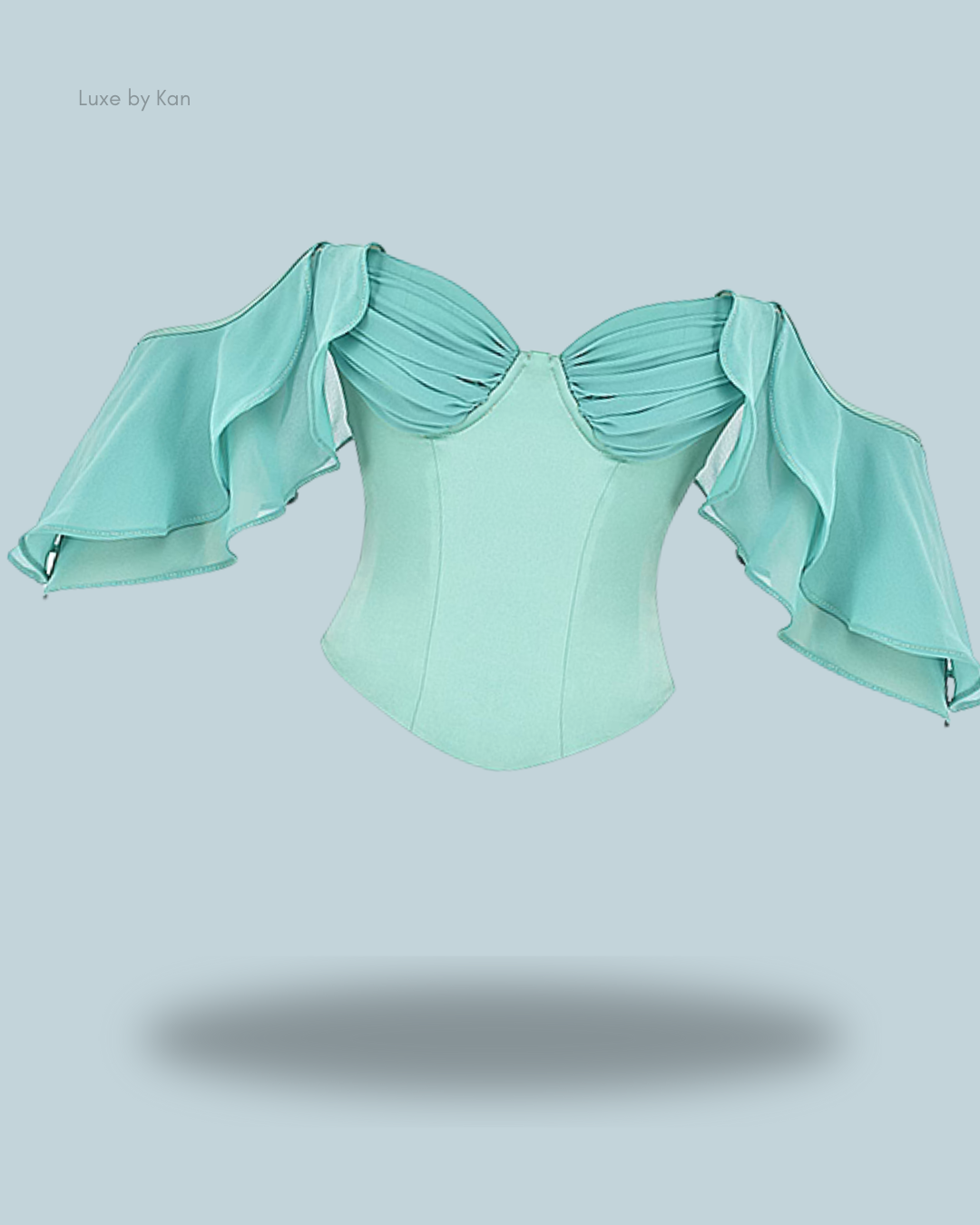 House of CB Isabella jade corset top featuring pleated shoulders, ruffle detailing, and flowing statement sleeves.