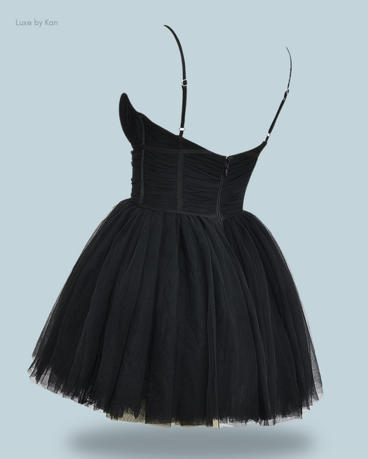 Elegant black tulle dress with a fitted bodice and one shoulder strap.