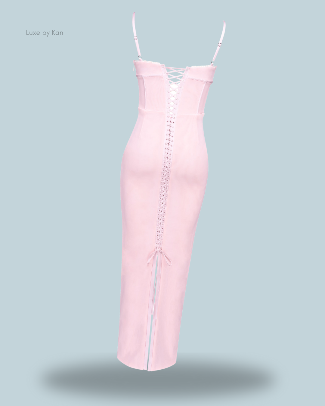 Elegant pink bodycon midi dress with lace-up back detail and adjustable spaghetti straps.