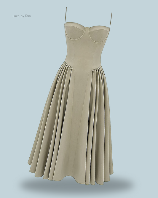 A stylish House of CB light green Amaria gathered midi dress, featuring a fitted bodice and a pleated skirt that adds graceful movement and elegance.