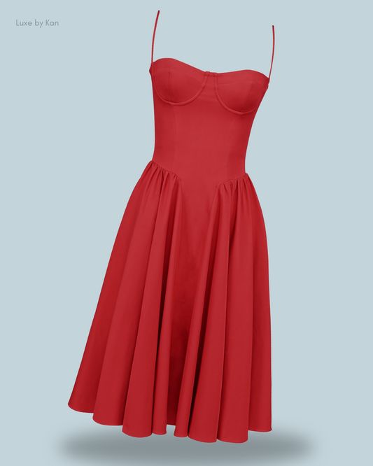 A vibrant red samaria gathered midi dress with a fitted bodice and flowing skirt.