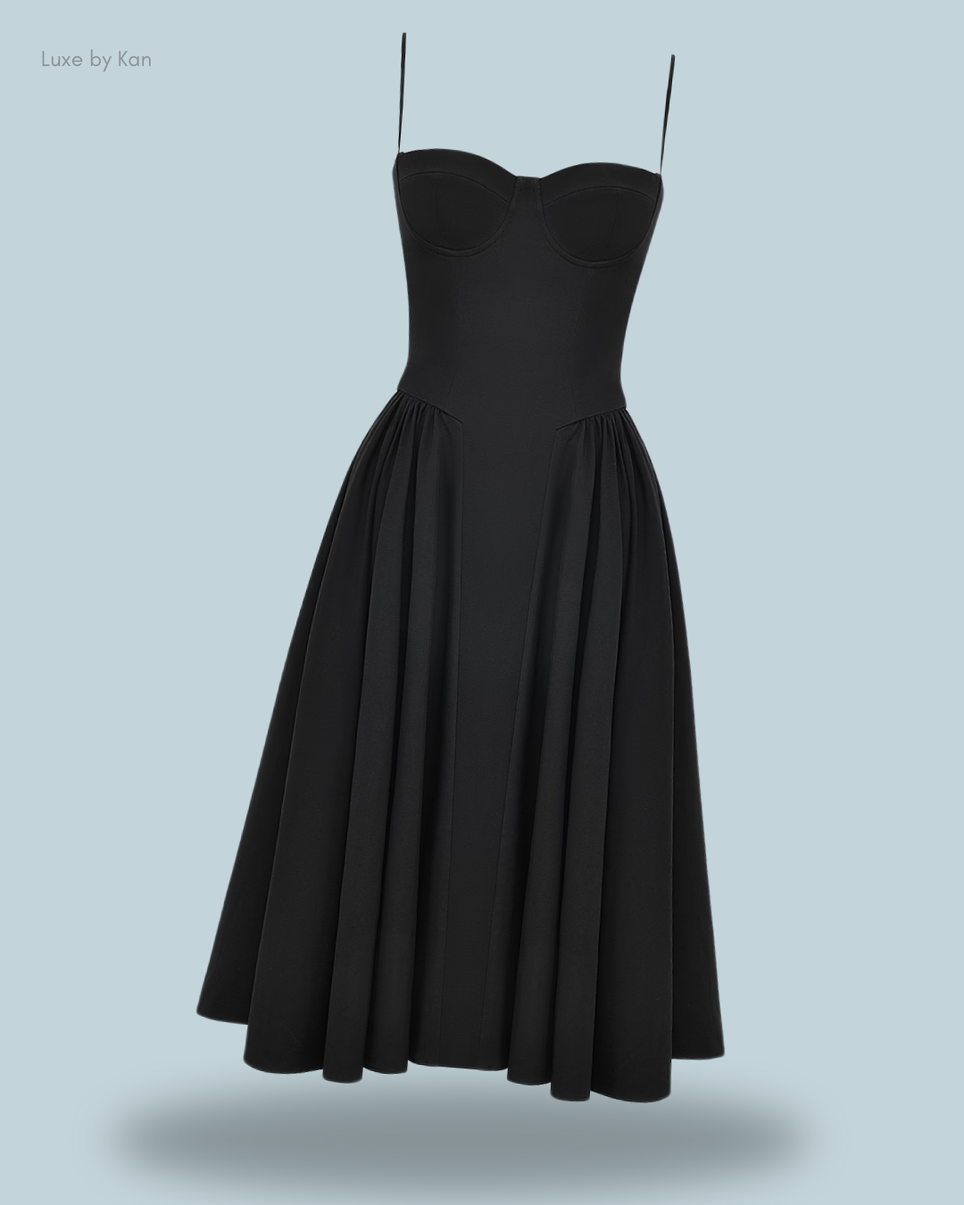 A sleek black samaria gathered midi dress with a fitted bodice, spaghetti straps, and a flared skirt.