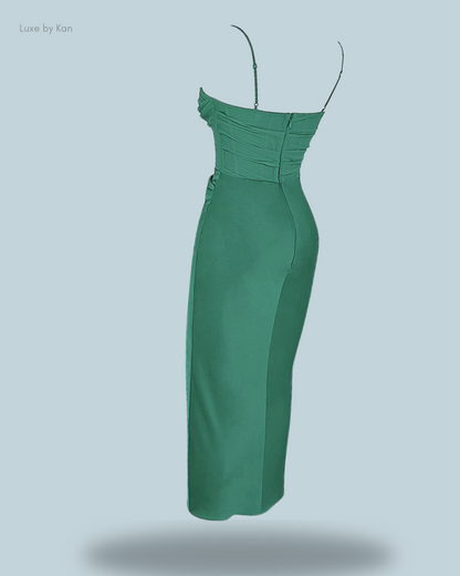 Back view of a stylish green Teia draped corset midi dress, featuring thin straps and a ruched bodice for an elegant, sculpted look.
