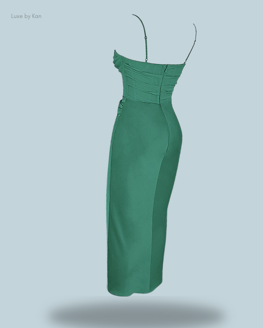 Back view of a stylish green Teia draped corset midi dress, featuring thin straps and a ruched bodice for an elegant, sculpted look.