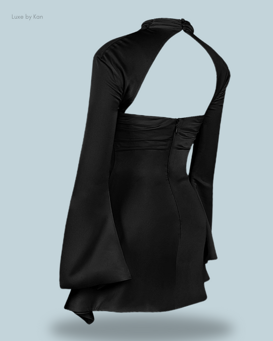 Back view of the Toira black draped corset dress, featuring long flared sleeves, a halter neck design, and an elegant, sculpted silhouette.