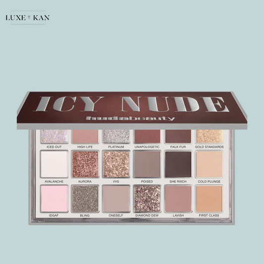 A Huda Beauty Icy Nude eyeshadow palette featuring 18 shades in various textures, including mattes and glitters, elegantly arranged.