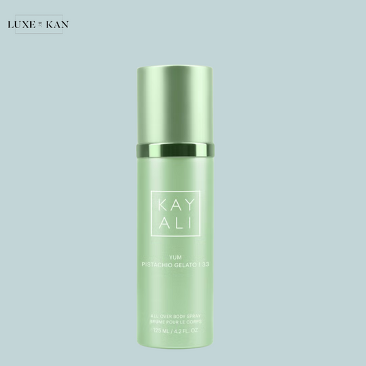 A green bottle labeled "KAYALI YUM Pistachio Gelato" for a body spray.