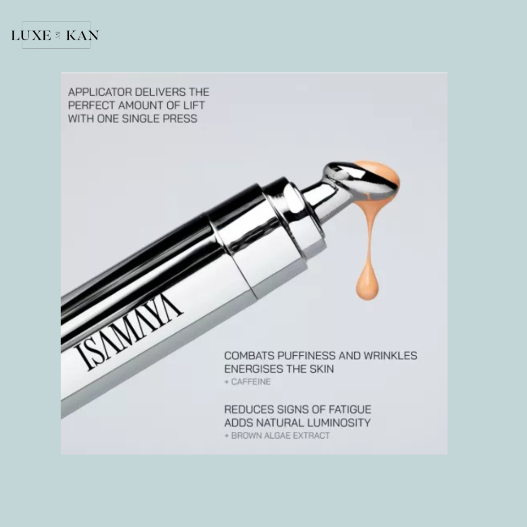 A sleek silver applicator delivers a peach-toned serum designed to reduce puffiness, wrinkles, and signs of fatigue, featuring caffeine and brown algae.