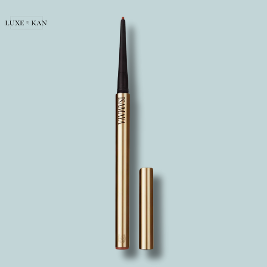 Isamaya beauty spur stick suede lip liner pencil standing upright with a matching cap beside it.