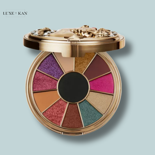 Opened wild star pressed pigment eyeshadow palette featuring 12 vibrant shades arranged in a circular design with a luxurious gold casing.
