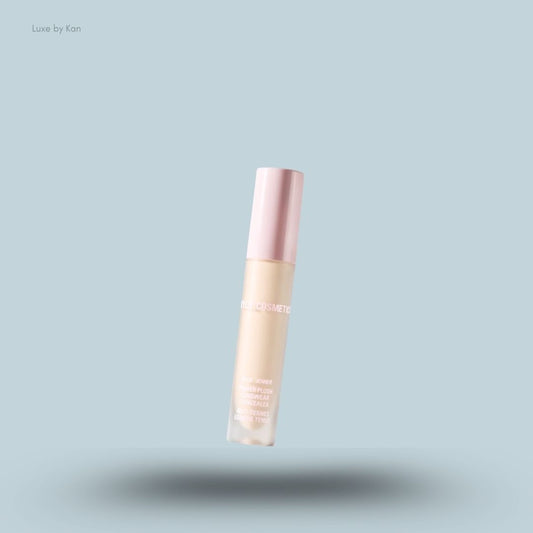 Kylie Cosmetics Power Plush Longwear Concealer bottle on blue background — LBK India