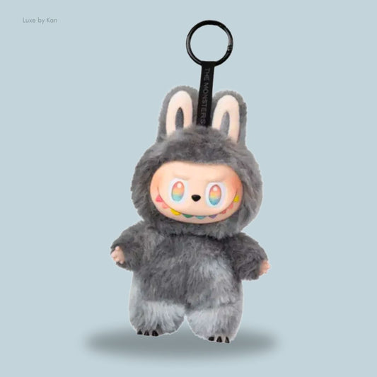 Labubu Big Into Energy ID (Grey) Secret Edition - a cute plush doll wearing a gray bunny costume with colorful eyes, featuring a keyring holder on top for easy attachment.