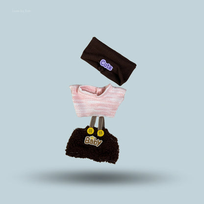 Three-piece Labubu outfit consisting of a brown headband with Cute written on it, a pink striped shirt, and brown overalls spelling Baby.