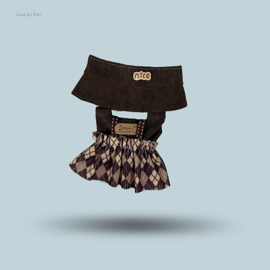 Two-piece Labubu outfit with a brown corduroy top and a brown and tan argyle skirt.