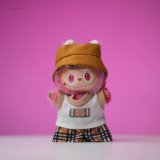 Labubu doll in a three-piece set including a brown bucket hat, white tank top with a Burberry pattern, and Burberry shorts.