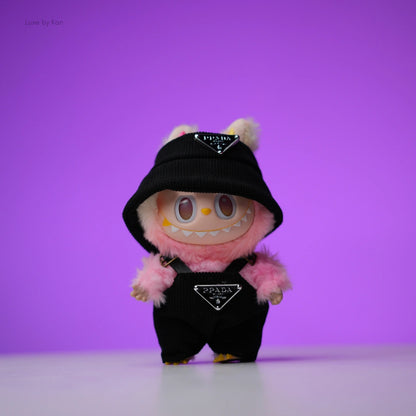 Pink Labubu doll wearing a black two-piece luxury streetwear set with Prada logos.