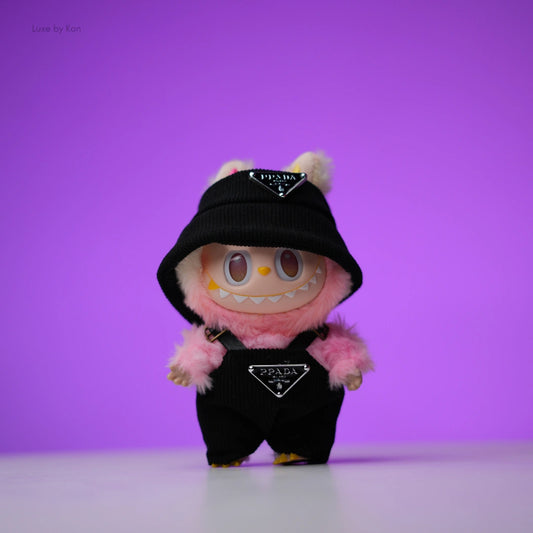 Pink Labubu doll wearing a black two-piece luxury streetwear set with Prada logos.