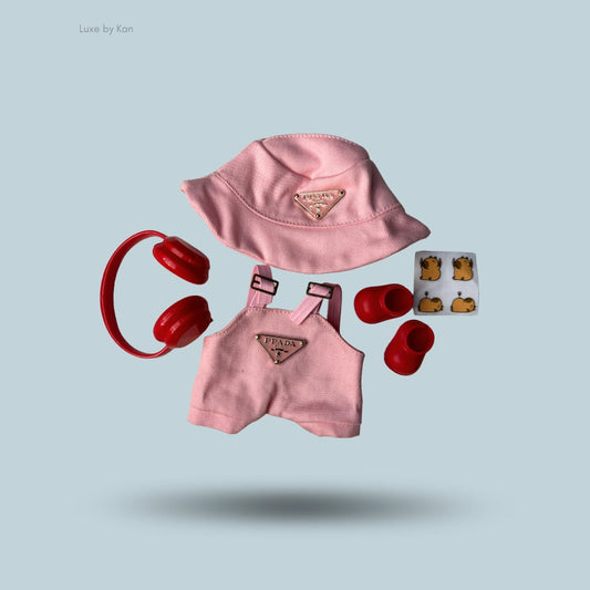 The Labubu doll wears a cozy two-piece streetwear set, including a corduroy hat and a dress adorned with a diamond argyle pattern.