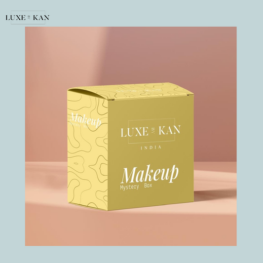 LBK full glam makeup mystery box set. A light-yellow Luxe Kan box on a light-pink surface with brand and set info displayed.