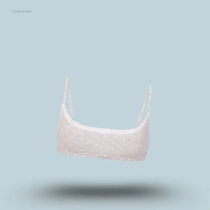 SKIMS Lightweight Cotton Pointelle Scoop Bralette in Light Heather Grey Pin Dot, flat lay on light blue background