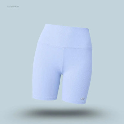 Alo 5 inch Seamless Ribbed Favorite Short in Light Provence Blue, flat lay on light blue background