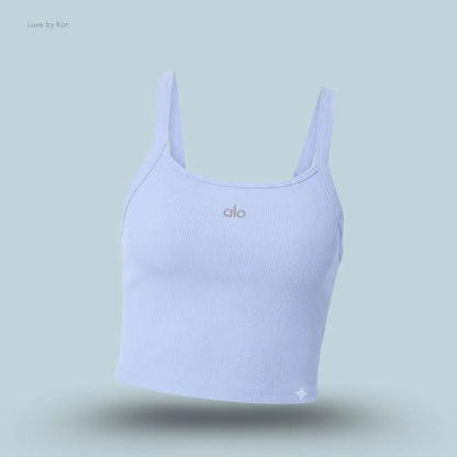 Alo Seamless Ribbed Favorite Bra Tank in Light Provence Blue, flat lay on light blue background