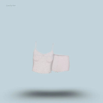 SKIMS Sleep Cami Set in Light Heather Grey, flat lay on light blue background