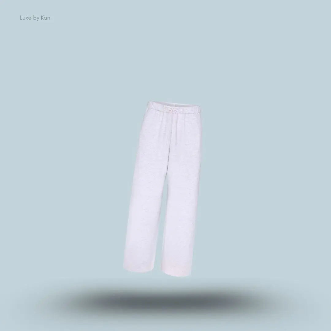 SKIMS Cotton Fleece Classic Straight Leg Pant in Light Heather Grey, flat lay on light blue background