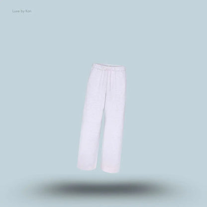 SKIMS Cotton Fleece Classic Straight Leg Pant in Light Heather Grey, flat lay on light blue background