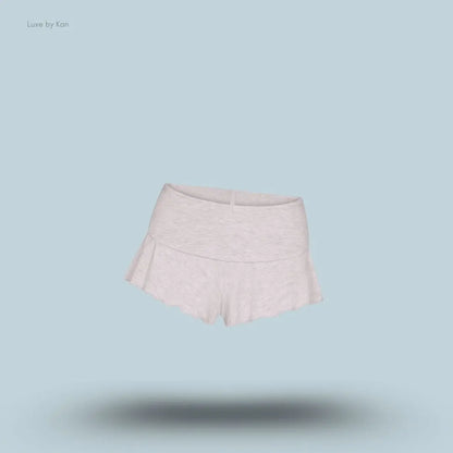 SKIMS Sleep Henley and Foldover Short Set foldover shorts in Light Heather Grey, flat lay on light blue background