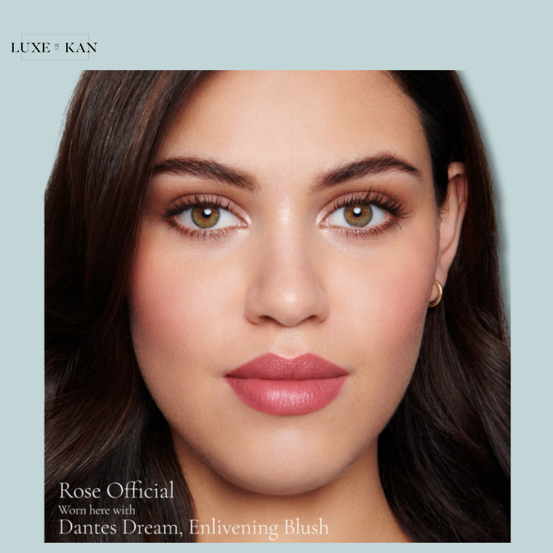 A close-up image showcasing luxurious hair and makeup, featuring Rose Cruicial, Dantes Dream, and Enlivening Blush products.