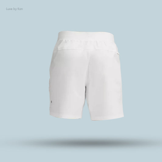 White shorts displayed against a light blue background, showcasing a relaxed fit and a simple, modern design.