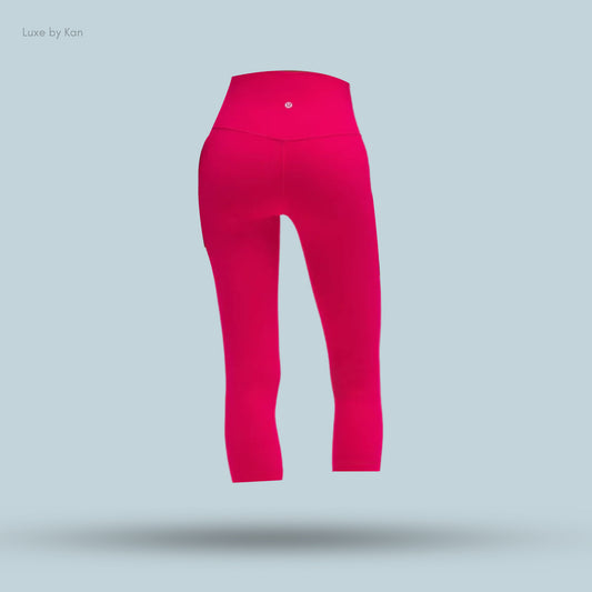 Bright pink athletic leggings, showcasing a high waistband and sleek design.