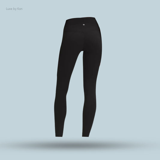Back view of sleek black Lululemon leggings from Luxe by Kan, featuring a smooth design and supportive high waistband.