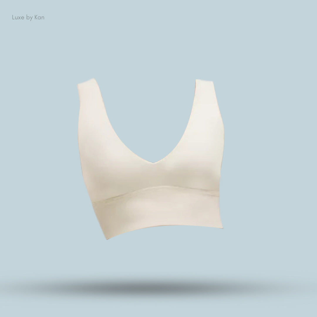 Light beige Lululemon bralette featuring a deep V-neckline and wide supportive straps.