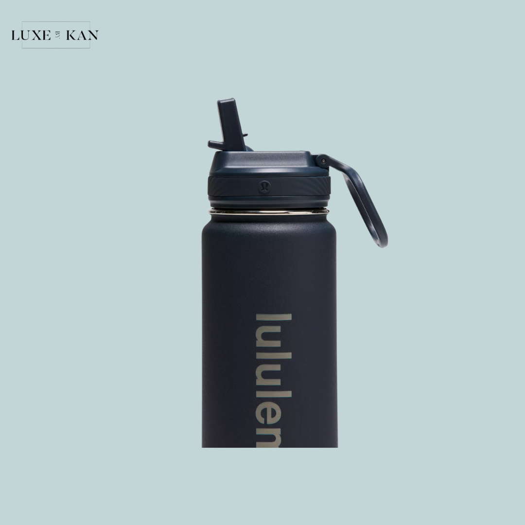 A sleek navy blue water bottle with a flip-top lid, featuring the "lululemon" logo prominently displayed.