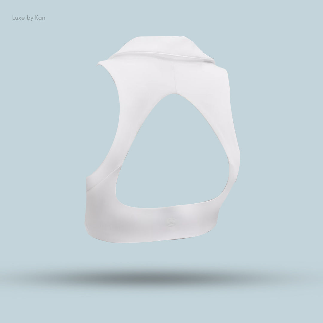 White sports bra with an open back design, featuring a sleek and modern look.