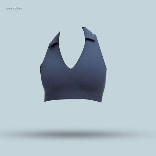 A navy Lululemon Collared Tennis Longline Bra with medium support for B/C cups, featuring a plunging neckline and a stylish collar.