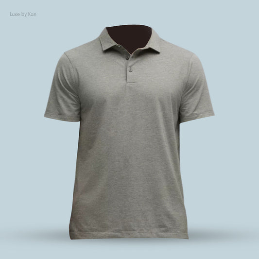 Gray polo shirt displayed against a light blue background, featuring a classic collar and three-button placket.