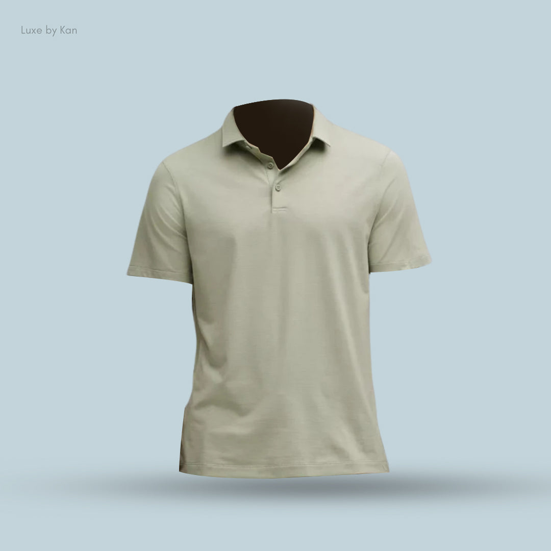 Light gray short-sleeve polo shirt displayed on a brown mannequin against a soft blue background. Brand: Luxe by Kan.