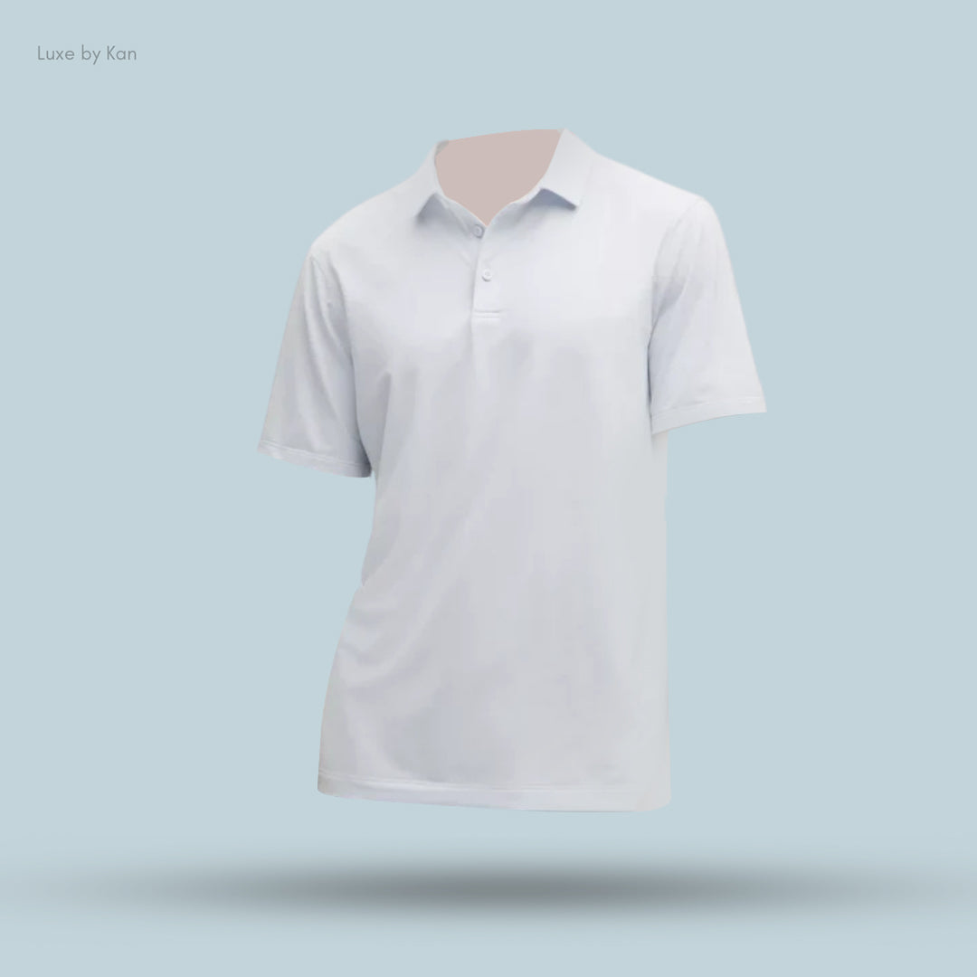 A white polo shirt displayed against a light blue background, featuring a collar and three-button placket, from Luxe by Kan.