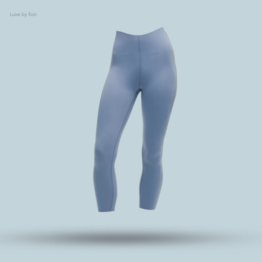 Light blue Lululemon Glow Up™ Super-High-Rise Crop 23" leggings, showcasing a sleek and smooth design.