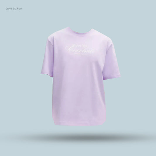 A lavender heavyweight cotton jersey Tennis Club T-shirt featuring the phrase “Meet You Countryside” printed in white cursive on the front.