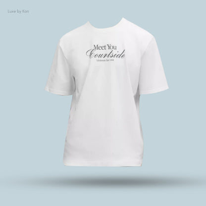 A white heavyweight cotton jersey Tennis Club T-shirt displaying the text “Meet You Courtside” with “Lululemon Est. 1998” below.