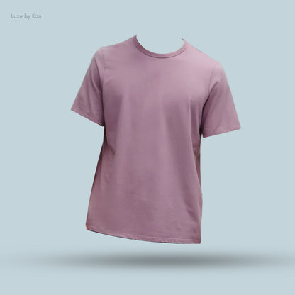 A short-sleeved lilac t-shirt displayed on a light blue background, emphasizing its relaxed fit and soft fabric.