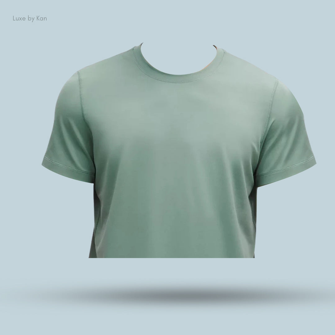 Light green short-sleeve t-shirt displayed against a soft blue background, featuring a classic crew neck design.