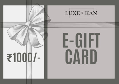 Luxe By Kan E-Gift Card featuring a graphic bow, ribbon, and ₹1000 value against contrasting neutral blocks.