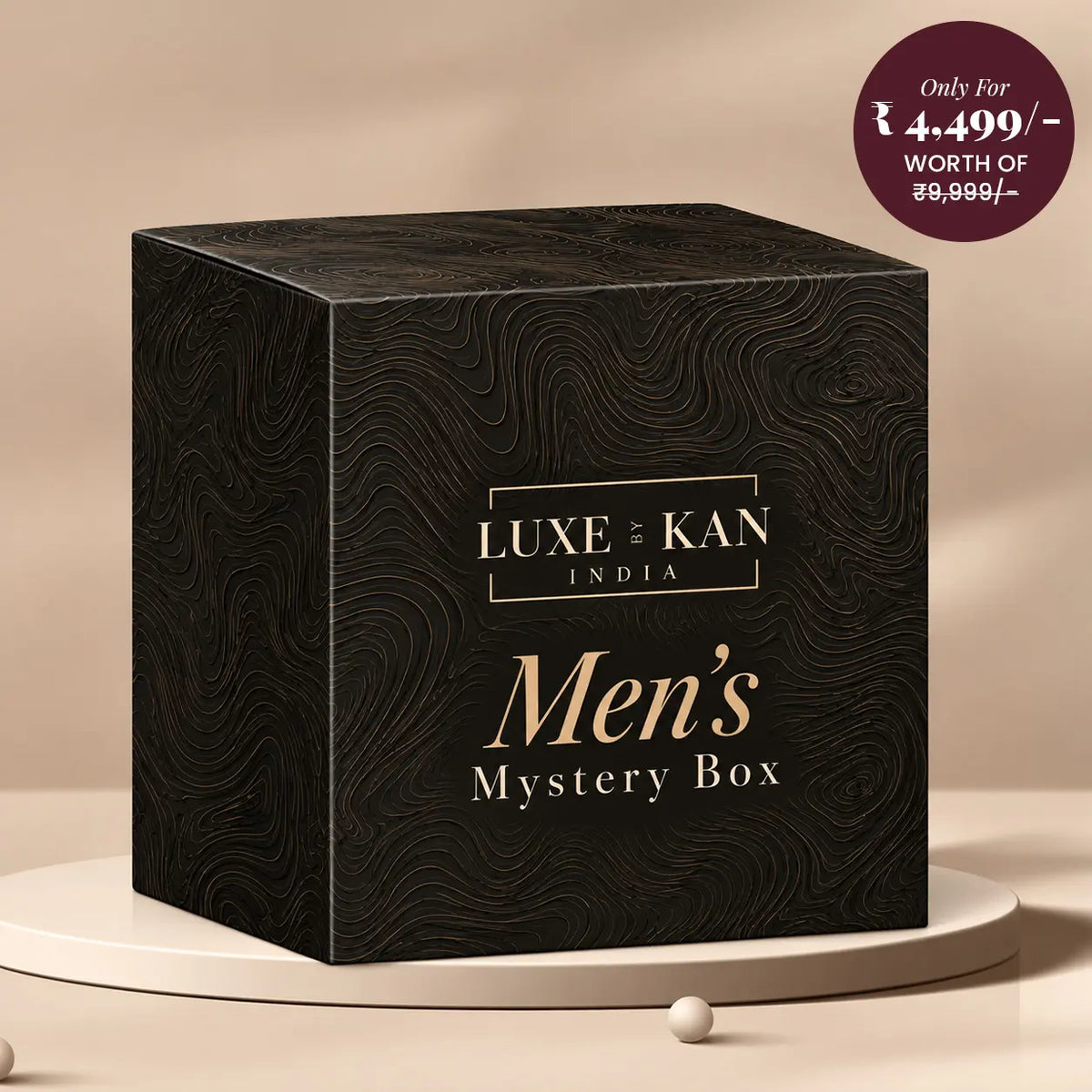 Luxe by Kan Men's Mystery Box black gift box with gold swirl pattern on a beige podium, classic ₹4,499 edition