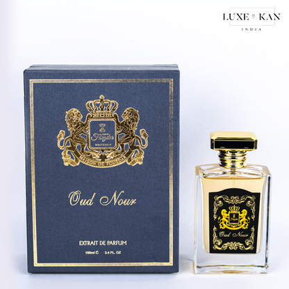 Maison de fouzdar oud nour perfume bottle next to a luxurious blue box.