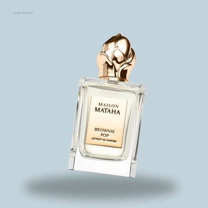 Maison Mataha Brownie Pop Extrait de Parfum, featuring a clear glass bottle and a gold cap.